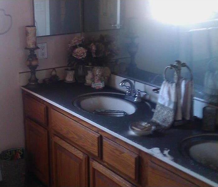 Bathroom countertop with heavy soot covering
