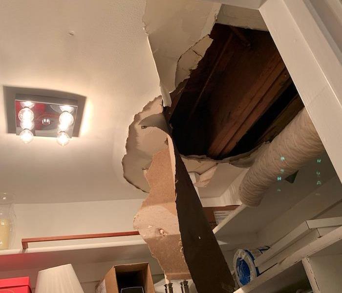 Closet ceiling with hole and ruined sheetrock