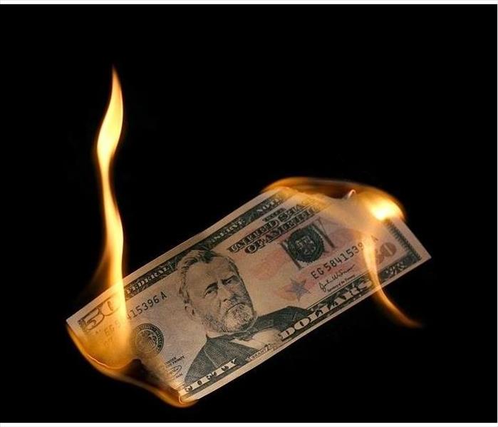 Fifty dollar bill burning on both ends